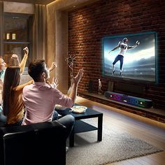 group of people watching tv in living room