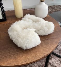 Alpaca fur slippers - alpaca slippers from Peru - unisex slippers - fur slippers - winter slippers - Gift for any occasion The unisex Luxurious Alpaca Fur Slippers keep your feet nice and cozy even on the most blustery winter's eve. These fur slippers are very well made, ensuring they will last for years. These baby alpaca slippers are made from the finest Alpaca fur and are guaraunteed to keep ones feet warm this winter. Material: Alpaca outer, sheepskin wool lines the inside, bottom suede Bene Comfortable Fluffy White Slippers, Cozy White Slippers With Plush Lining, Fluffy Round Toe Winter Slippers, White Fluffy Slippers With Round Toe, Cozy Fluffy Winter Slippers, Fluffy Faux Fur Slippers For Winter, White Fluffy Indoor Slippers, Fluffy White Indoor Slippers, Fluffy White Slip-on Slippers