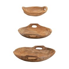 three pieces of wood sitting on top of each other in the shape of oval shapes