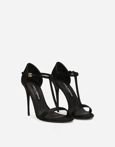 Find DOLCE & GABBANA Satin T-bar Sandals on Editorialist. Satin sandals with DG logo: Black 105-mm heel Kidskin insole with branded label Branded leather sole Item comes with a branded dust bag Made in Italy