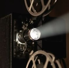 a close up view of a machine with some light coming out of it's center