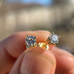 Men's and women's 1ct moissanite stud earrings. 1CT -5MM each stone (0.5ct each round stone). 14k gold vermeil over solid 925 sterling silver. Passes the thermal diamond test (test pen). Will show up as Moissanite on a lab analysis. Beautiful dazzling rainbow disco-ball effect. The moissanite shines so hard it will blind you. Stylish and secure screw back fasteners. Will never ever turn your skin or ears green. Buy with confidence with 30 day returns. 100% FREE SHIPPING in USA. Order now! Dazzling Yellow Gold Diamond Earrings With Sparkling Stones, Yellow Gold Sterling Silver Drop Diamond Earrings, Silver 14k Gold Earrings With Sparkling Stones, Luxury Silver-colored Gold-plated Diamond Earrings, Polished Yellow Gold Sterling Silver Diamond Earrings, Hip Hop Jewelry, Moissanite Earrings, Disco Ball, Solid 925 Sterling Silver