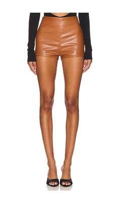 The Nookie Faux Leather Shorts feature a high rise, a hidden back zipper closure, and a flat front. They are made from 60% polyurethane, 35% polyester, and 5% spandex. The lining is 95% polyester and 5% spandex. The shorts are approximately 11.5 inches in length. They are made in Australia and should be spot cleaned.