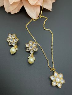 This is a unique kundan set that is so perfect to gift to the special person you would like! It is made of high quality uncut stones and has a gold finish but is extremely elegant to wear even for everyday use. Grab this gorgeous piece soon as I have limited stock! Diwali Kundan Necklace Pendant With Latkans, Kundan Necklace As A Diwali Gift, Temple Jewelry Sets With Gota Work For Gifts, Silver Kundan Necklace With Gota Work For Gift, Bollywood Style White Jewelry Sets For Gifts, White Kundan Necklace With Meenakari For Gift, Kundan Cutdana Jewelry Sets Gift, Kundan Necklace For Diwali Gift, Festive Kundan Pendant Necklace As Gift