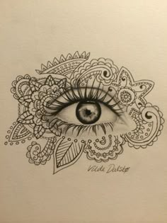 a drawing of an eye with paisley designs on it's side and the words, i