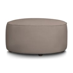 a round ottoman that is sitting on the floor