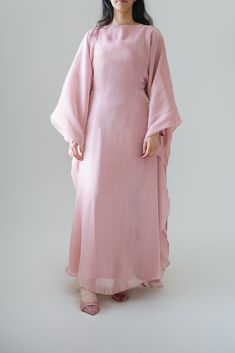 Indulge in our new Luxury silk Kaftan, part of our newest collection. A beautiful rose quartz shade that would look perfect for any occasion. The kaftan can be tied with the inner belt or styled with a loose fit (as shown in pictures) can be worn from a size S - XL. This Kaftan comes with a under layer dress Width: 60cm  This design comes in three shades; Rose Quartz, Cream, Lavender. * model is 5 ft 6 * material:  Premium silk Organza * fabric can differ due to lighting and also production whil Eid Evening Maxi Length Thobe, Pink Dabka Kaftan For Eid, Formal Maxi Length Thobe For Eid, Pink Wedding Kaftan For Eid, Elegant Maxi Length Eid Kaftan, Elegant Dabka Embellished Maxi Dress, Pink Maxi-length Thobe For Eid, Pink Maxi Length Thobe For Eid, Long Pink Abaya For Eid