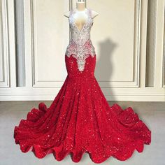 Unveil your inner goddess with our exquisite Red Sequin Mermaid Gown. This stunning masterpiece is meticulously adorned with shimmering sequins that catch the light with every movement, creating a dazzling effect that ensures you won't go unnoticed. The deep V-neckline and intricate beaded detailing at the bodice add a touch of elegance and sophistication, making it the perfect choice for any grand event or special occasion.The mermaid silhouette hugs your curves in all the right places, flaring Glamorous Red Carpet Mermaid Dress, Glamorous Mermaid Dress For Prom And Red Carpet, Glamorous Mermaid Dress For Red Carpet And Prom, Glamorous Floor-length Mermaid Dress For Red Carpet, Glamorous Red Mermaid Dress For Prom, Red Sequin Mermaid Dress For Prom Season, Red Sequined Mermaid Dress For Prom, Glamorous Red Mermaid Dress For Red Carpet, Glamorous Red Fishtail Gown