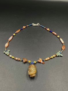 The Beautiful Necklace Consist Of Old Antique Roman's Human Head Carved In Agate As Bead Pendant Along With Other Birds Figures Carved As Bead In Agate Stone . Some Small Lapis ,Carnelian And Gold Beads Are Used As Spacers In The Necklace. Size And Details Pictures Are Listed Above. Beaded Agate Amulet Style Necklace, Beaded Agate Amulet Necklace, Beaded Agate Amulet Necklaces, Agate Amulet Pendant Beaded Necklace, Agate Pendant Amulet Style Beaded Necklaces, Amulet Style Agate Beaded Necklaces For Jewelry Making, Pendant Beaded Necklaces With Polished Agate Beads, Agate Amulet Beaded Necklaces For Jewelry Making, Agate Pendant Necklace With Polished Beads