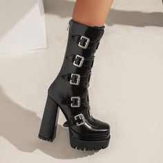 Looking for a unique and stylish way to add some edge to your wardrobe? Check out our gothic platform boots! These beautiful black boots are perfect for dressing up or down. and they really make a statement. They feature buckles for a dramatic look. and they're calf-height for added style. Plus. they have a chunky platform heel that provides both comfort and style.Whether you're hitting the town or just hanging out at home. our gothic platform boots are sure to add some fun and flair to your loo Gothic Moto Boots For Winter Party, Gothic Boots With Buckle Closure For Concert, Gothic High Heel Combat Boots For Fall, Gothic Winter Platform Ankle Boots, Gothic Black Platform Boots For Party, Gothic Black Mid-calf Boots With Platform, Punk Style Winter Platform Boots For Night Out, Punk Style Platform Boots For Winter Night Out, Gothic High Heel Platform Boots For Winter