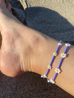 🌊 Handmade in Marina Del Rey, Southern California "Summer Daisies" Beaded Anklet is perfect for layering with other anklets, on the sandy beach, staycation at home or great to wear with any outfit. Each piece is unique as it is handmade and inspired daily. No two are alike. 🌊 Very Lightweight and comfortable 🌊 Premium quality Glass Seed Beads in size 12/0 (approx. 2mm and 3mm)  🌊 Durable nylon thread or Durable monofilament cord 🌊 Silver plated over alloy lobster clasp  🌊 2" extender chain added upon request Please note this order is for only one anklet with the bigger daisies. The smaller daisies are available under a different listing :) Beaded Anklets With Round Beads For Beach, Summer Anklets With Tiny Beads, Bohemian Beaded Bracelets For Beach In Spring, Summer Tiny Round Bead Anklets, Bohemian Beaded Bracelets For Spring Beach, Beach Anklet With Tiny Beads On A Strand, Blue Beach Anklets With Round Beads, Adjustable Tiny Beads Anklets For Summer, Adjustable Flower Beaded Bracelets For Beach