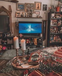 a living room filled with furniture and a flat screen tv sitting on top of a wooden table