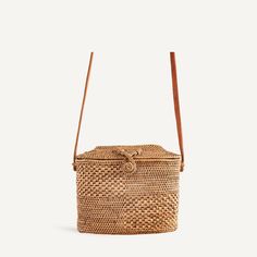 From the cobble-stoned streets of Lisbon to sun-soaked Amalfi, this is a staple vacation accessory. A classic basket bag with a crisscross clasp and angular top roof, it’s sturdy enough to hold your vintage camera. Slip it on with a pair of sandals and your best denim to whisk yourself into summer. Handwoven rattan Lea Rectangular Natural Bucket Bag With Intrecciato Weave, Basket-shaped Straw Bag With Intrecciato Weave, Straw Bucket Shoulder Bag With Intrecciato Weave, Natural Woven Leather Crossbody Straw Bag, Rectangular Intrecciato Weave Bucket Bag For Vacation, Rectangular Intrecciato Weave Shoulder Bag For Vacation, Summer Rectangular Bucket Bag With Intrecciato Weave, Rectangular Bucket Bag With Intrecciato Weave For Vacation, Rectangular Natural Bags With Intrecciato Weave