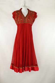 Vintage Lipstick Red Bollywood Empire Waist Dress Lipstick red dress with detailed embroidery, beads and rhinestone design all over the velvet bodice. Eye hook closure at the back of the neck. A sheer outer layer that features a velvet near the hem of the dress. Label: Unknown - No Tag Present Measurements are taken flat; Shoulders: 16 inches Sleeve: 2 inches Cuff: 6 1/4 inches Neck: 7 1/2 inches Bust: 18 inches Waist: 14 inches Hips: 20 inches Length (shoulder to hem): 48 1/2 inches Condition M Bollywood Sequin V-neck Dress, Festive Evening Dress With Embroidered Neckline, Festive Anarkali Dress With Embroidered Neckline, Anarkali Dresses With Embroidered Neckline For Festive Occasions, Anarkali Dresses With Embroidered Neckline For Festive, Red Floor-length Dress For Fancy Dress Occasion, Bollywood Style V-neck Festive Dress, Bollywood Style Festive V-neck Dress, Festive Bollywood V-neck Dress