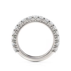 a diamond set wedding ring on a white background