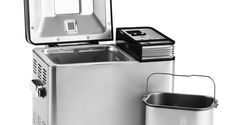 a stainless steel ice chest and bucket next to each other