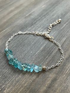 This bracelet is made with natural blue apatite chips and silver-toned chain. It also has a 1.5 inch adjustable chain, making the bracelet anywhere from 6.5 to 8 inches in order to create a perfect fit for the user.  *Because this jewelry is made of natural gemstones, please allow for small variations in gemstone size, color, and texture. However, every effort will be made to have the product accurately match the image shown on the listing Shipping Information ---------------------- This jewelry Apatite Jewelry, Bracelets Pearl, Chip Bracelet, Chain Making, Natural Stone Jewelry, Blue Apatite, Bracelets Handmade Beaded, Color And Texture, Bracelet Handmade