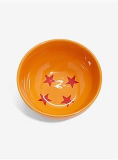 an orange bowl with red stars on it