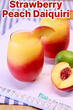 two glasses filled with peaches on top of a white tray