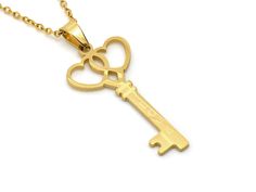 "A necklace in Stainless Steel with a golden key pendant that is 38 mm (a bit under one and a half inches) long. It is matte on the back and has the word \"Love\" on it. The chain is included and is 18\" (45 cm) long plus a 2\" extender is also attached! The jewelry is Nickel safe and we test it regularly." Gold Heart Necklace With Two Keys, Heart Skeleton Key, Key Necklace Gold, Heart Skeleton, Skeleton Key Necklace, Golden Key, The Word Love, Key To My Heart, Word Love