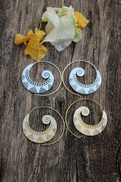 Sellers tip :  Buy more than 1 item from our shop to save shipping cost.These Beautiful Spiral Hand Crafted Earrings that are suitable for normal pierced Ears , just hook them in . These Earrings feature a stunning and Unique design . An organic and original earring that will turn heads wherever you wander, forest or city!Note:- These are not stock photos – these are actual photos taken of the item listed. However, since screen resolutions vary, the colors “in-person” may be slightly different t Bohemian Gold Earrings With Artistic Design, Bohemian Brass Jewelry With Artistic Design, Bohemian Metal Cartilage Earrings For Gift, Gold Earrings With Artistic Design For Festivals, Bohemian Metal Jewelry With Artistic Design, Spiral Ear Wire Earrings For Festival, Bohemian Brass Earrings With Artistic Design, Gold Spiral Bohemian Earrings, Bohemian Metal Hoop Earrings For The Beach