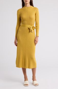 A soft ribbed sweater-dress fashioned with a mock neck and tie belt offers sophisticated style. Mock neck Long sleeves Slips on over head Tie belt Ribbed knit construction Unlined 87% rayon, 13% polyester Machine wash, dry flat Imported Model stats: 5'10" height, 32" bust, 25" waist, 36" hip. Model is wearing size S. Midi Sweater Dress, Head Tie, Ribbed Sweater Dress, Daytime Dresses, Sweater Dress Midi, Sweaters And Leggings, Comfortable Dress, Ribbed Sweater, Sophisticated Style