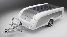 an electric vehicle with solar panels on the roof