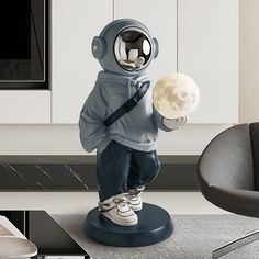 a statue of an astronaut holding a ball