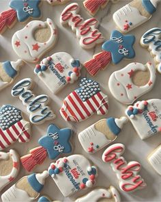 decorated cookies are displayed on a table for an american flag themed party, including the presidential symbols