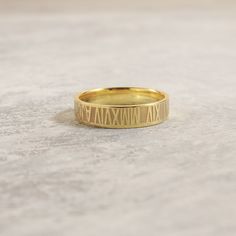 A stunning statement of love and devotion! Our Roman Numeral Ring is the perfect accessory for any special occasion, featuring a personalized inscription of your special date. A thoughtful and meaningful gift for any loved one, this custom ring makes for a memorable anniversary, birthday, or Mother's Day present. Customizable Yellow Gold Promise Ring, Gold Wedding Rings With Engraved Text, Gold Promise Ring With Engraved Text, Formal Personalized Rose Gold Rings, Personalized Rose Gold Rings For Formal Occasions, Elegant Wedding Ring With Engraved Text, Gold Jewelry With Engraved Text For Promise, Personalized Gold Rings For Wedding, Personalized Gold Wedding Rings