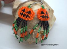 Stylish earrings for Halloween, Seed bead pumpkin earringsThese pumpkin earrings for Halloween are specially made for you to emphasize your style for the holiday.They emphasize your style and help you stand out from everyone else.This earrings is made from the high-quality Czech bead, with the use of sterling silver furnice, with a bright pumkin pattern. This pumpkin earrings can carry every girls and woman of any age, harmonizes with any clothes.Earrings details:Length: Dangle earrings measure Beaded Pumpkin Earrings, Halloween Seed Bead, Bead Pumpkin, Beaded Pumpkin, Earrings Handmade Beaded, Pumpkin Bead, Witch Pumpkin, Halloween Beads, Earrings Halloween