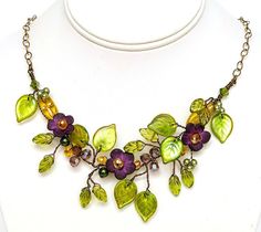 Flower necklace for women in purple adds a pretty pop of color to your attire.  Add a touch of romance for the bride, bridesmaids or the prom queen.  The flowers and vines in my garden were the inspiration for the beautiful piece of wearable art. Details: * Length 17-20 inches (length includes chain extension) * Bronze colored copper wires * Natural brass non-tarnish chain * Handmade hook clasp * Czech Glass Beads and Austrian crystals Please note the shape and style of beads may change dependin Necklaces Purple, Green Necklaces, Purple Jewellery, Botanical Necklace, Purple Flower Necklace, Vine Necklace, Leaf Jewellery, Vine Jewelry, Boho Wedding Jewelry