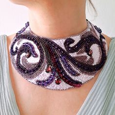 Purple embroidered necklace. Beaded collar. Bridal boho style necklace. Statement necklace. Choker necklace. Dimensions: 2,75 inches (7 cm) wide at the widest point, 13,4 inches (34 cm) long + 24.4 inches (62cm) ribbon from each side. Closure - velour ribbon. Materials: Czech beads, Japanese beads, crystals, beads of different shapes, sequins, eco-suede, ribbon. We will pack securely and ship within 1-2 business days. An elegant and sophisticated purple embroidered necklace with a stunning combi Artisan Embroidered Necklaces For Festivals, Traditional Embroidered Beaded Necklaces For Festivals, Handmade Traditional Choker Bib Necklaces, Traditional Handmade Choker Bib Necklaces, Traditional Handmade Bib Choker Necklaces, Traditional Handmade Bib Necklace Choker, Elegant Embroidered Multicolor Jewelry, Elegant Multicolor Embroidered Jewelry, Festival Beaded Bib Necklace Choker