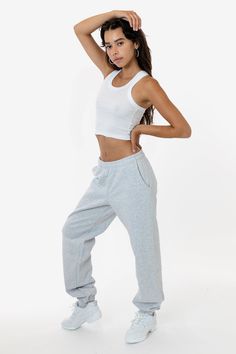 Made from a luxurious 14oz fleece, this sweatpants is incredibly soft and warm, yet still breathable and moisture-wicking. The relaxed fit allows for a full range of motion, making it perfect for lounging around the house, running errands, or hitting the gym. This sweatpant is Piece Dyed. Our piece-dyed sweatpants fabric is dyed before they're cut and sewn, which results in a more uniform color distribution throughout. This means you'll get pants with a cleaner, sharper look, without any color v Fleece Sweatpants For Loungewear, Basic Fleece Sweats For Loungewear, Fleece Sweatpants For Loungewear In Athleisure Style, Fleece Pants For Loungewear, Fleece Pants For Loungewear In Athleisure Style, Fleece Pants For Athleisure Loungewear, Fleece Pants For Loungewear And Athleisure, Loungewear Sportswear Sweatpants, Sporty Loose Fit Gym Sweatpants