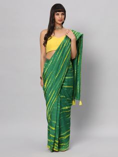 This light weight Green Tie dye saree is a versatile saree that is a must have in your wardrobe. This saree is extremely light weight will give you great pitures and can be worn for different ocassions. Team this saree up with Yellow raw silk blouse & statement earrings. Suitable for Poojas, Day function, brunhes, Wedding & haldi functions. Product Features: Saree Color: Green & yellow Blouse Color: Yellow Saree Fabric: Georgette silk Blouse Fabric: Raw Silk Saree Work: Tie Dye Print Wash Care: Designer Green Slub Silk Dupatta, Green Slub Silk Lehenga With Dupatta, Festive Green Slub Silk Lehenga, Green Slub Silk Lehenga For Navratri, Festive Green Slub Silk Traditional Wear, Green Tussar Silk Pre-draped Saree With Dupatta, Green Cotton Silk Dupatta For Navratri, Designer Yellow Slub Silk Blouse Piece, Green Slub Silk Traditional Wear With Cutdana