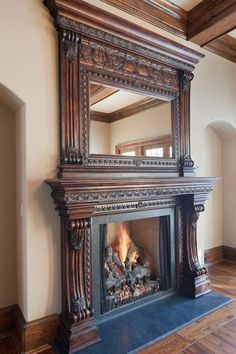 a fireplace with a mirror on top of it