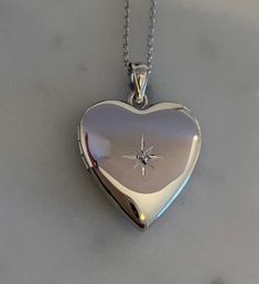 "Diamond Heart Locket in Sterling Silver, * 3/4 Inch Pendant * Holds 2 Photos * Solid 925 Sterling Silver, NOT Plated * Chain in 6 Lengths, 16\", 18\", 20\", 22\", 24\", 30\" * Gift for Women: Mother, Grandmother, Daughter, Sister, Wife, Friend * Rhodium Anti-Tarnish Coating * Comes in Gift Box with Velvet Pouch Thank you for visiting HarperSilver! 🎁Packaging: This item comes gently packaged in a fabric pouch housed inside of a silver foil linen box with a silver bow. It is ready to present as Cheap Silver Heart Locket Necklace, Affordable Silver Heart Locket Necklace, Luxury Sentimental Heart-shaped Jewelry, Cheap Silver Pendant Locket Necklace, Silver Locket Necklace Aesthetic, Affordable Silver Round Locket Necklace, Silver Heart Locket Necklace, Heart Locket Aesthetic, Sister Christmas Gift Ideas