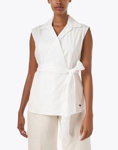 The Dakar top from Weekend Max Mara will be a versatile and sleek staple in your wardrobe. Crafted from comfortable cotton, the airy material combined with a self tie waist creates a flattering wrap silhouette. Style yours with jeans and a woven bag to keep it neutral or play with pops of color to elevate the look in another way. Casual Cotton Blouse With Tie Waist, Spring Cotton Blouse With Tie Waist, Casual Cotton Wrap Top For Spring, Chic Cotton Wrap Top For Summer, Cotton Tie Waist Tops For Daywear, Chic Cotton Wrap Top For Spring, Versatile Wrap Top For Spring Workwear, Versatile Wrap Top For Work And Spring, Versatile Spring Wrap Top For Workwear