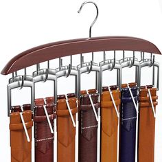 a coat rack with umbrellas hanging from it's hooks and hangers in different colors