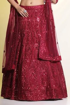 Maroon lehenga featuring floral embroidery with cutdana, resham, and sequin work. Paired with a padded embellished blouse and a matching dupatta., Fit: Relaxed Unstitched Anarkali Set With Sequins, Sequin Lehenga For Eid Reception, Eid Reception Lehenga With Sequins, Floor-length Sequin Fabric For Diwali, Party Wear Gown With Intricate Embroidery For Festive Occasions, Embellished Gown For Navratri, Embellished Gown For Navratri Festive, Embellished Festive Gown For Navratri, Festive Embellished Gown For Navratri