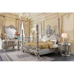 an ornate bedroom with gold and silver furniture