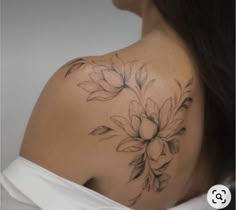 a woman with a flower tattoo on her back shoulder