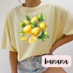 Trendy Vintage Watercolor Lemon Comfort Colors T-Shirt Add a splash of zest to your wardrobe with our Vintage Watercolor Lemon Comfort Colors T-Shirt! 🍋 This trendy tee features a beautifully detailed watercolor lemon design that captures the essence of fresh, sunny days. Perfect for those who love unique, artistic fashion, this shirt is a must-have for your casual collection. 🌿 Features: High-Quality Material: Made from soft, durable Comfort Colors fabric, ensuring a cozy fit and long-lasting Yellow Summer Top With Sublimation Print, Yellow Sublimation Print Top For Summer, Yellow T-shirt With Lemon Print For Spring, Summer Lemon Print Crew Neck Top, Trendy Summer Tops With Lemon Print, Summer Short Sleeve Top With Lemon Print, Relaxed Fit Lemon Print Summer Tops, Summer Lemon Print Graphic Tee, Yellow Funny Print Top For Summer