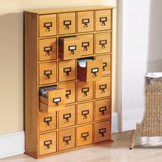 a wooden cabinet filled with lots of drawers