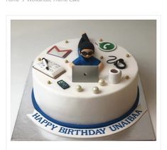 a birthday cake with an image of a person working on a laptop and office supplies