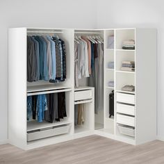 a white closet filled with lots of clothes