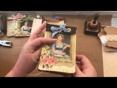 someone is holding an altered photo in front of some crafting supplies on a table