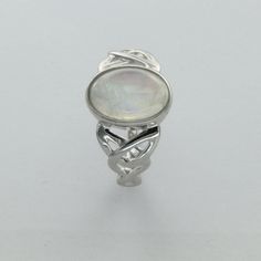 These is a beautiful pair of Sterling Silver Ring with a Rainbow Moonstone Gemstone. The ring are made out of solid 925 Silver and there is no nickel or other substances causing most allergies. This makes the ring hypo allergenic. Size of the Moonstone 1.2 x 0.8 cm or 0.47 x 0.31 inch You will receive the item in a gift box - perfect to surprise someone or yourself. Usually we ship on the same day we receive the payment for the order. We want you to be happy with your purchase. If you do not lik Sterling Silver White Gold Moonstone Ring, Sterling Silver Oval Cabochon Moonstone Ring For Anniversary, Elegant Sterling Silver Moonstone Ring With Stone Setting, Silver Sterling Moonstone Wedding Ring, White Gold Moonstone Ring In Sterling Silver, Silver Moonstone Ring Hallmarked, Sterling Silver Cabochon Opal Ring For Anniversary, Silver Polished Moonstone Promise Ring, Sterling Silver Opal Ring With Cabochon For Anniversary