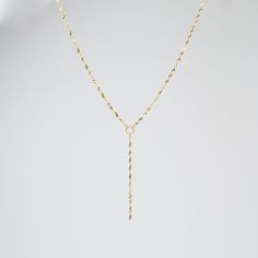 "14k Gold Y Necklace. 14K sparkle chain necklace. 14k delicate y necklace. This necklace is beautiful and delicate. The necklace will arrive in a gift box, ready for delivery. 14K gold necklace 14K gold drop chain (The picture in the listing is 2\") All components are 14k gold Please read our policies before you place your order. https://www.etsy.com/shop/SashJewelry/policy?ref=shopinfo_policies_leftnav To see other bracelets click here https://www.etsy.com/shop/SashJewelry?section_id=12354075&a Long Drop Yellow Gold Necklace With Delicate Chain, Gold Backdrop Necklace With Delicate Long Drop Chain, Dainty Gold Long Drop Backdrop Necklace, Delicate Yellow Gold Lariat Backdrop Necklace, 14k Gold-filled Drop Necklace With Delicate Chain As Gift, Gold Heart Bracelet, Mother Daughter Necklace, Small Bracelets, Daughter Necklace