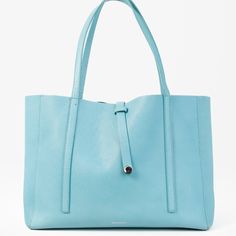 This Bright And Beautiful Tote Bag From Tiffany & Co Features An All Leather Upper In Their Signature Turquoise Blue, Double Top Handles, Rope And Loop Closure, And Spacious Interior Black Leather Lining With An Additional Zipper Closure Pouch And Two Slip Pockets. Condition: Good; Leather On The Top Rim Of The Bag Is Cracked, Handles And Body Of The Bag Are Stained. Includes Dust Bag. Approximate Measurements: Height: 10.75" (27 Cm) Width: 18" (45.75 Cm) Depth: 6" (15 Cm) Handle Drop: 9.5" (24 Tiffany Bag, Tiffany And Co, East West, Shopping Tote, Metal Hardware, Tiffany & Co., Turquoise Blue, Womens Tote Bags, On The Top